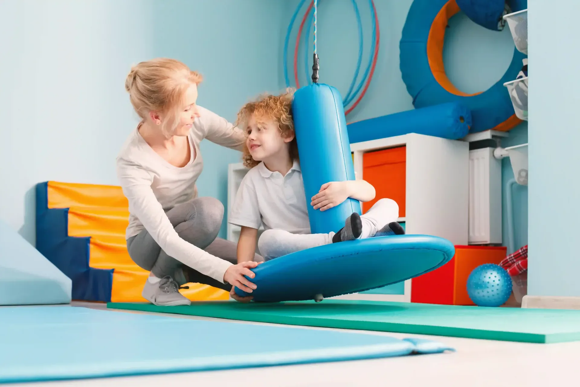 Boy engaging with sensory integration equipment